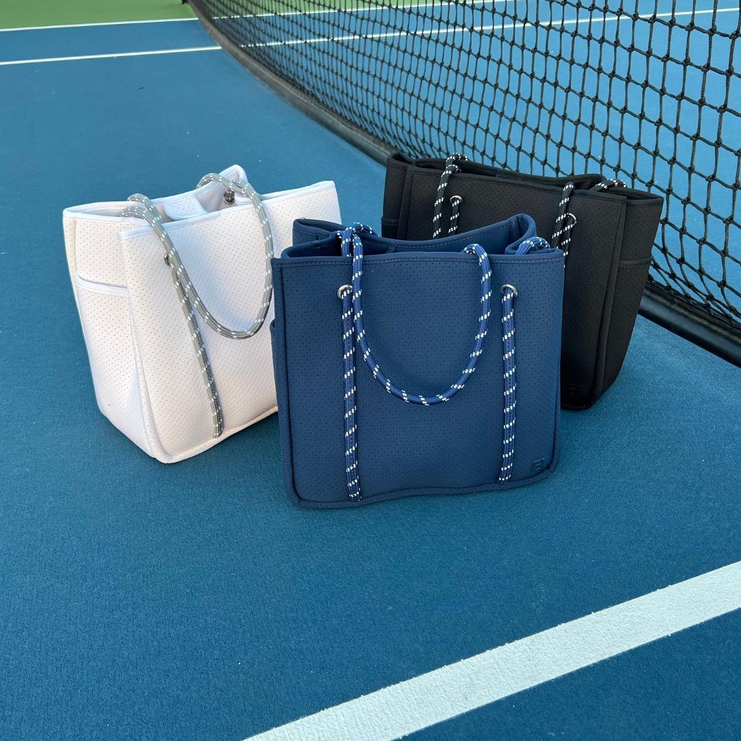 Five Love Courtside Racket Totes are offered in many colors, including sophisticated solids for the country club conservative. 